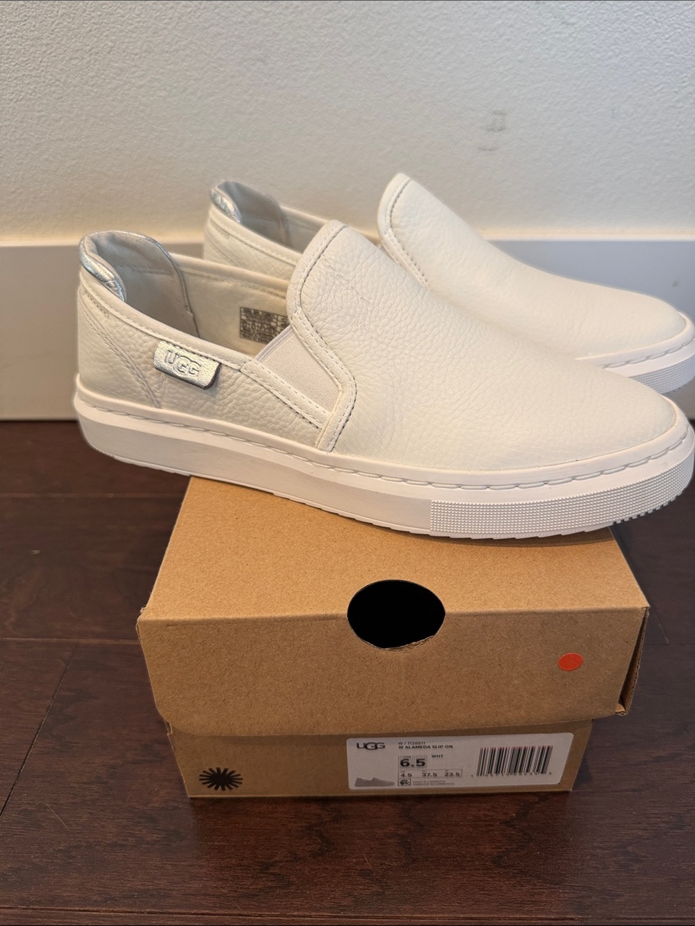 UGG women’s White Leather Slip-On Sneakers